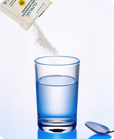 Image demonstrating pouring OLPRUVA powder into water, showing step-by-step preparation of the oral suspension.